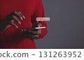 Customer Review, Young man hand holding smartphone to review and gives 1 star 131263952