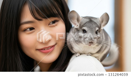 Chinchilla on woman's shoulder 131264039