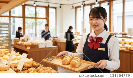 A woman working part-time at a bakery 131264779