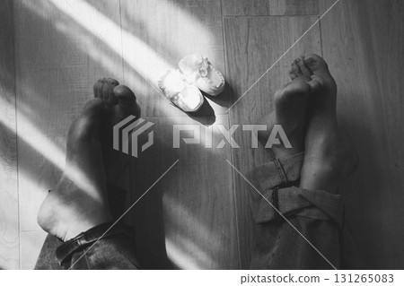 Relaxing at Home with Baby Shoes in Sunlight 131265083