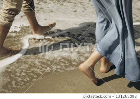 Barefoot Walk on Sandy Beach with Ocean Waves Barefoot Walk on Sandy Beach with Ocean Waves 131265098