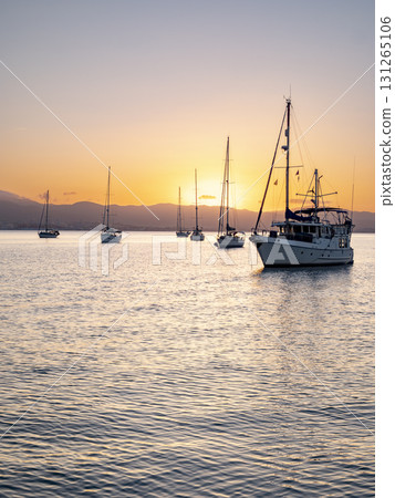 Anchored Yachts at Sunset in the Bay of Algeciras Anchored Yachts at Sunset in the Bay of Algeciras 131265106
