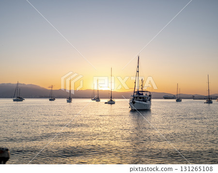 Sailboats anchored in the Bay of Gibraltar at sunset Sailboats anchored in the Bay of Gibraltar at sunset 131265108