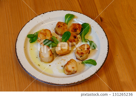 Delicious fried scallops on a table Delicious fried scallops on a table 131265236