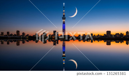 Skytree and the moon reflected on the mirror-like surface of the water 131265381