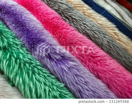 Colorful faux fur fabrics displayed in a textile shop for crafting and fashion design projects 131265568