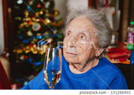 Elderly white woman celebrating New Year 131266401