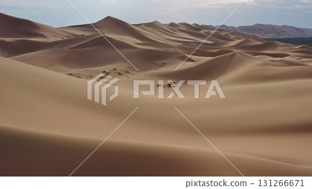 Aerial view of sand dunes in desert at sunset Aerial view of sand dunes in desert at sunset 131266671