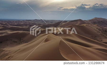 Aerial view of sand dunes in desert at sunset Aerial view of sand dunes in desert at sunset 131266674