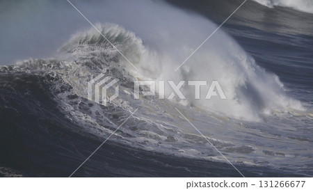 Large wave rolling on surface of stormy ocean Large wave rolling on surface of stormy ocean 131266677