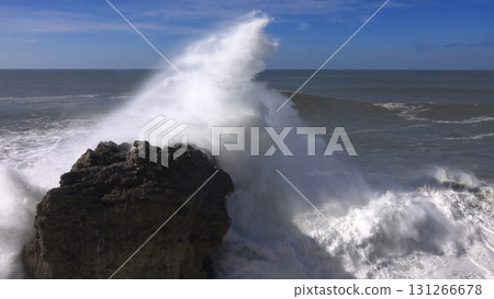 High waves breaking on rocks of coastline High waves breaking on rocks of coastline 131266678