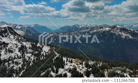 Rocky mountains in snow and green fir forest Rocky mountains in snow and green fir forest 131266708
