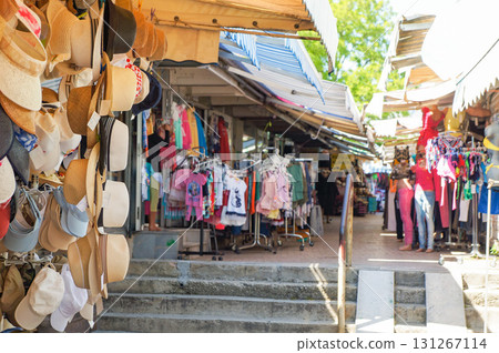 A street lined with souvenir shops with a hat shop in the foreground A street lined with souvenir shops with a hat shop in the foreground 131267114