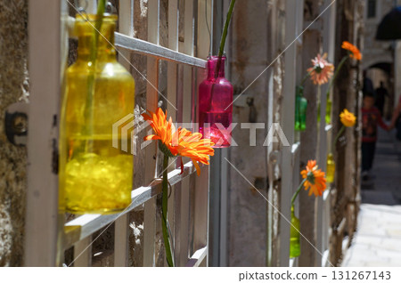 Photo of an exterior wall decorated with colorful flowers 131267143