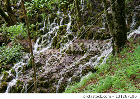A small amount of water flowing over the rocks 131267190