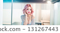 Woman making a phone call at a cafe 131267443