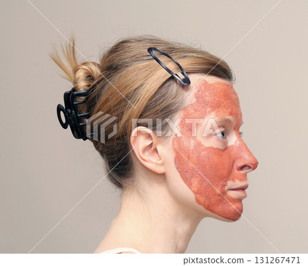 Female face with clay mask 131267471