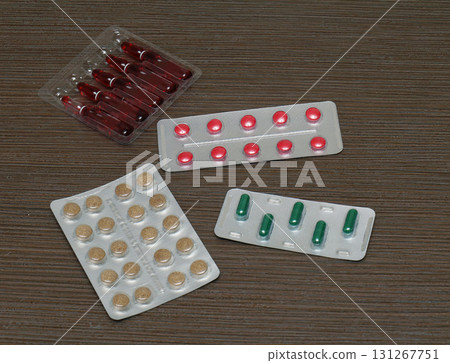 Injection vials and colorful pills 131267751