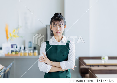 A young woman working in a cafe A young woman working in a cafe 131268120