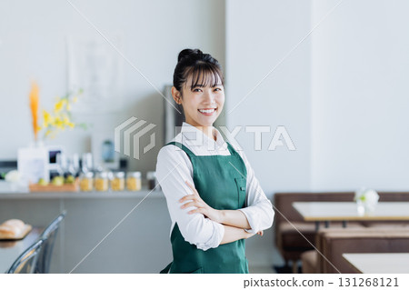 A young woman working in a cafe A young woman working in a cafe 131268121