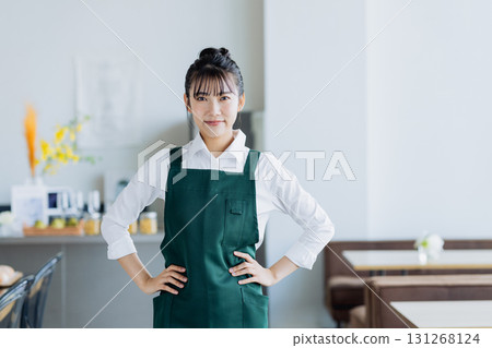 A young woman working in a cafe 131268124
