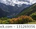 Autumn view of Morskie Oko surrounded by the mountain peaks of the High Tatras. 131269356