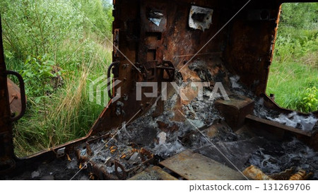 Rusty and burned-out armored vehicles on ukrainian territory. Exhibition of destroyed military equipment of the russian army. War between Ukraine and russia. Close up Slow motion Rusty and burned-out armored vehicles on ukrainian territory. Exhibition of destroyed military equipment of the russian army. War between Ukraine and russia. Close up Slow motion 131269706