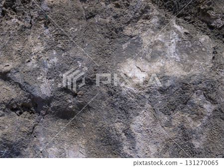 Texture of ancient rock formation showcasing layers in sunlight at midday Texture of ancient rock formation showcasing layers in sunlight at midday 131270065