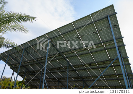 Innovative solar panel installation harnesses renewable energy under a clear blue sky Innovative solar panel installation harnesses renewable energy under a clear blue sky 131270311