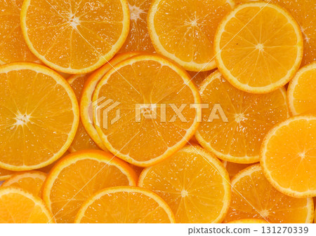 Bright orange slices arranged artistically create a vibrant display of fresh fruit goodness Bright orange slices arranged artistically create a vibrant display of fresh fruit goodness 131270339