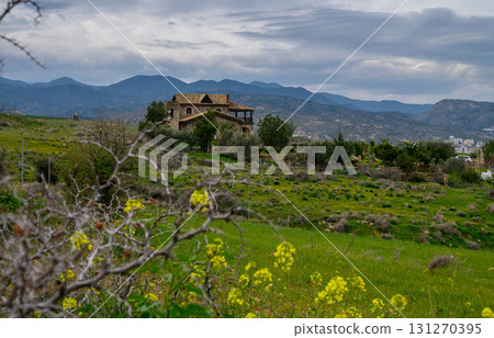 Majestic countryside residence nestled among rolling hills and blooming flora Majestic countryside residence nestled among rolling hills and blooming flora 131270395