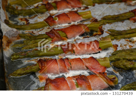 Savory asparagus bundles wrapped in crispy bacon cooked to perfection a sunlite 131270439