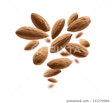 Almond nuts levitate on a white background Almond nuts levitate on a white background 131270960