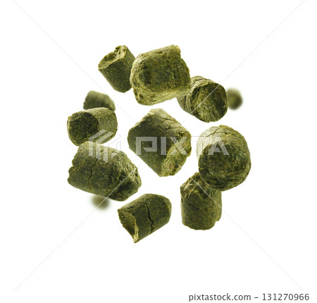 Green granulated hops levitate on a white background Green granulated hops levitate on a white background 131270966