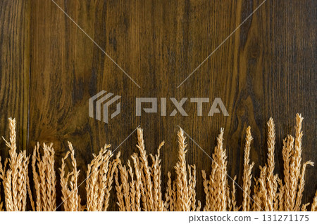 Wooden background along the edge with cereals. Decorations for background. Wooden background along the edge with cereals. Decorations for background. 131271175