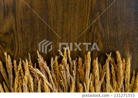Wooden background along the edge with cereals. Decorations for background. 131271553