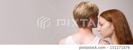 Young couple portrait back view with intimate minimalist style Young couple portrait back view with intimate minimalist style 131271876