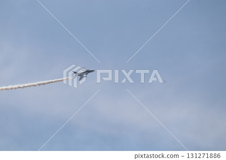 Blue Impulse T-4 trainer performing aerobatics 131271886