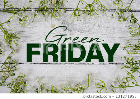 Green Friday text with artificial leaf decoration on wooden background 131271953