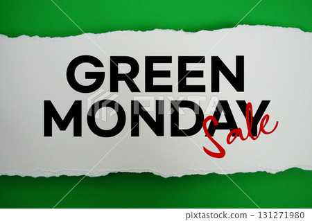 Green Monday Sale text on white paper torn ripped horizontal on green background 131271980