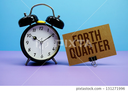 Forth Quarter text with alarm clock on blue and purple background 131271996