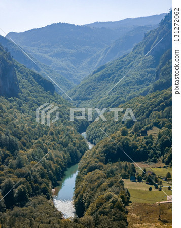 Panoramic view of Tara River canyon flowing through forested mountains in Durmitor National Park, Montenegro. Ideal for autumn travel, nature landscapes, adventure tourism, and as background or 131272062