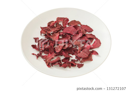 Food prep. Freeze-dried vegetable for travel. Dried beetroot on a ceramic plate isolated on a white background. 131272107