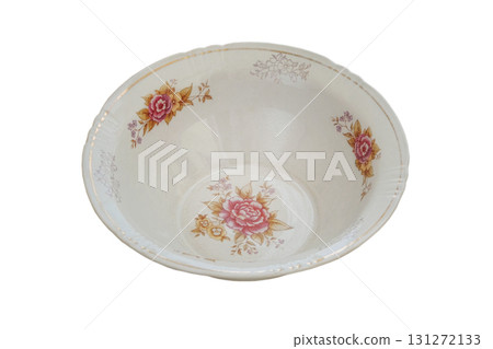 Plate with a pattern of flowers isolated on a white background. Ceramic tableware. Porcelain kitchenware. Plate with a pattern of flowers isolated on a white background. Ceramic tableware. Porcelain kitchenware. 131272133