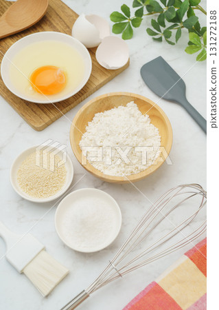 Cooking and baking image (flour, eggs, salt, brown sugar) on white marble background 131272188