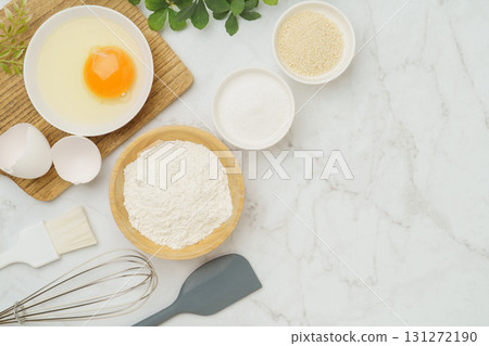 Cooking and baking image (flour, eggs, salt, brown sugar) on white marble background 131272190