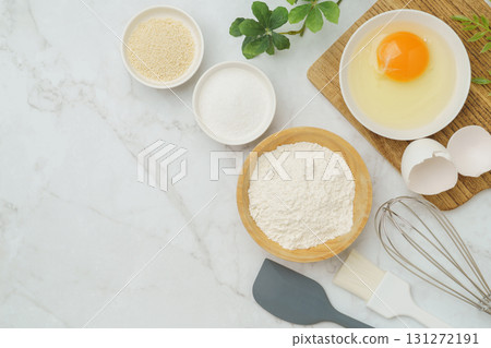 Cooking and baking image (flour, eggs, salt, brown sugar) on white marble background 131272191