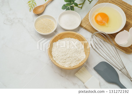 Cooking and baking image (flour, eggs, salt, brown sugar) on white marble background 131272192