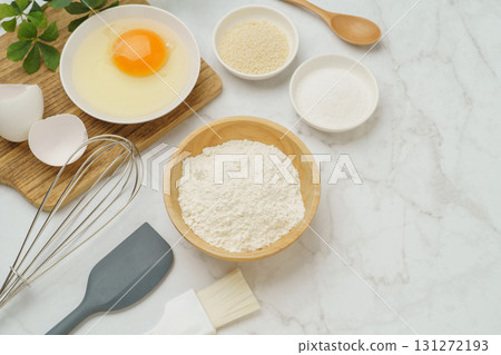 Cooking and baking image (flour, eggs, salt, brown sugar) on white marble background 131272193