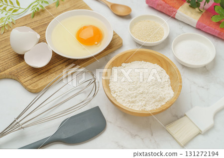 Cooking and baking image (flour, eggs, salt, brown sugar) on white marble background Cooking and baking image (flour, eggs, salt, brown sugar) on white marble background 131272194